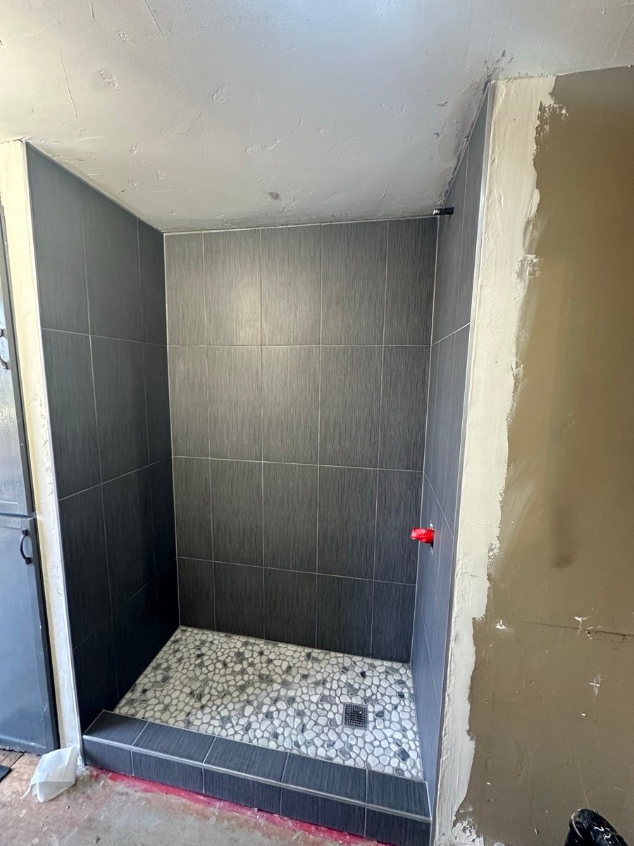 Shower finished floor to ceiling in tile