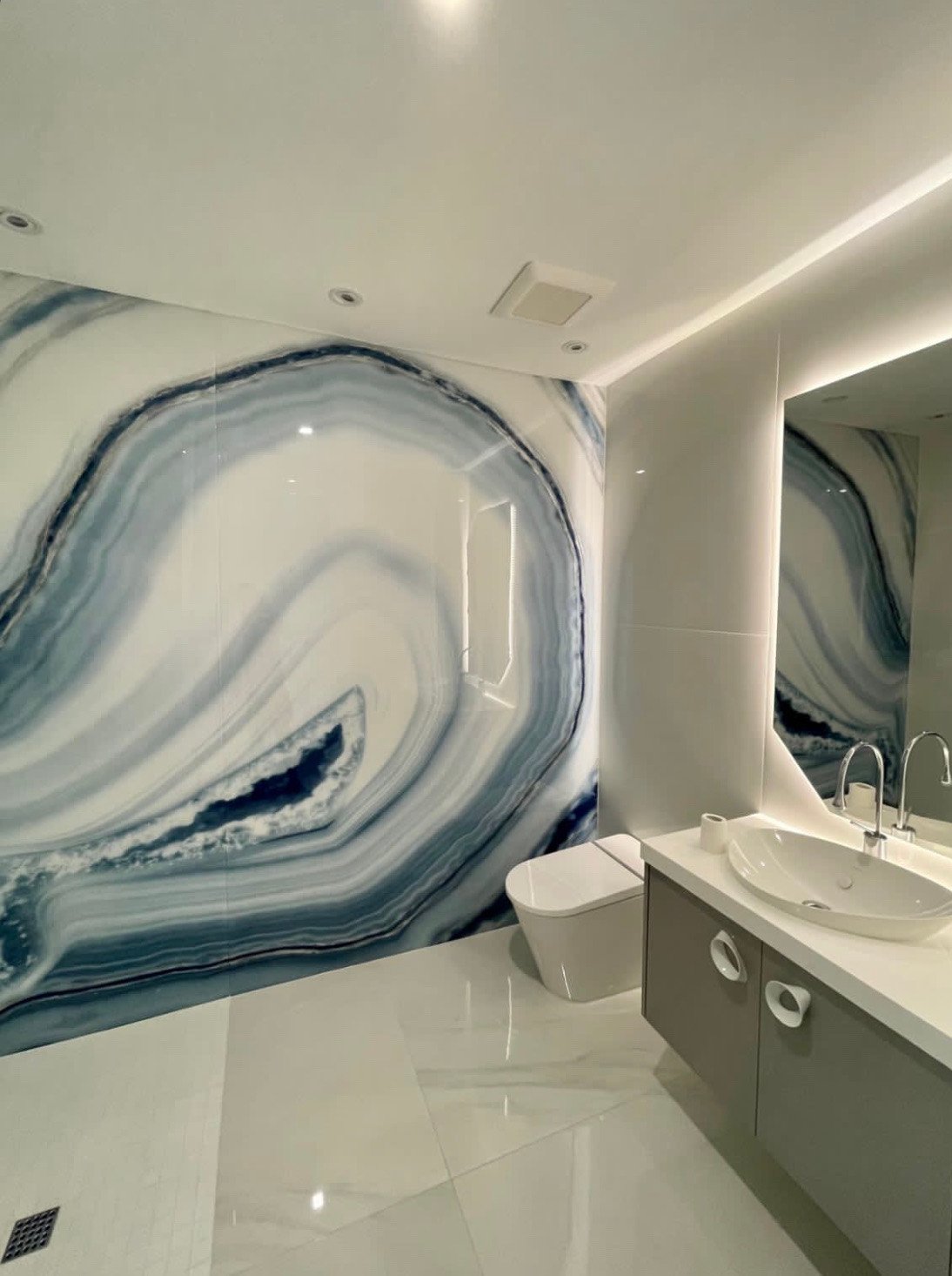 Blue and white agate-look bookmatched stone slab