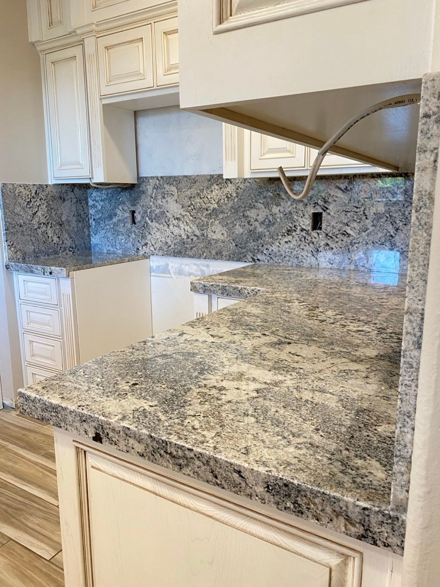 Traditional kitchen with granite countertops and cream cabinetry