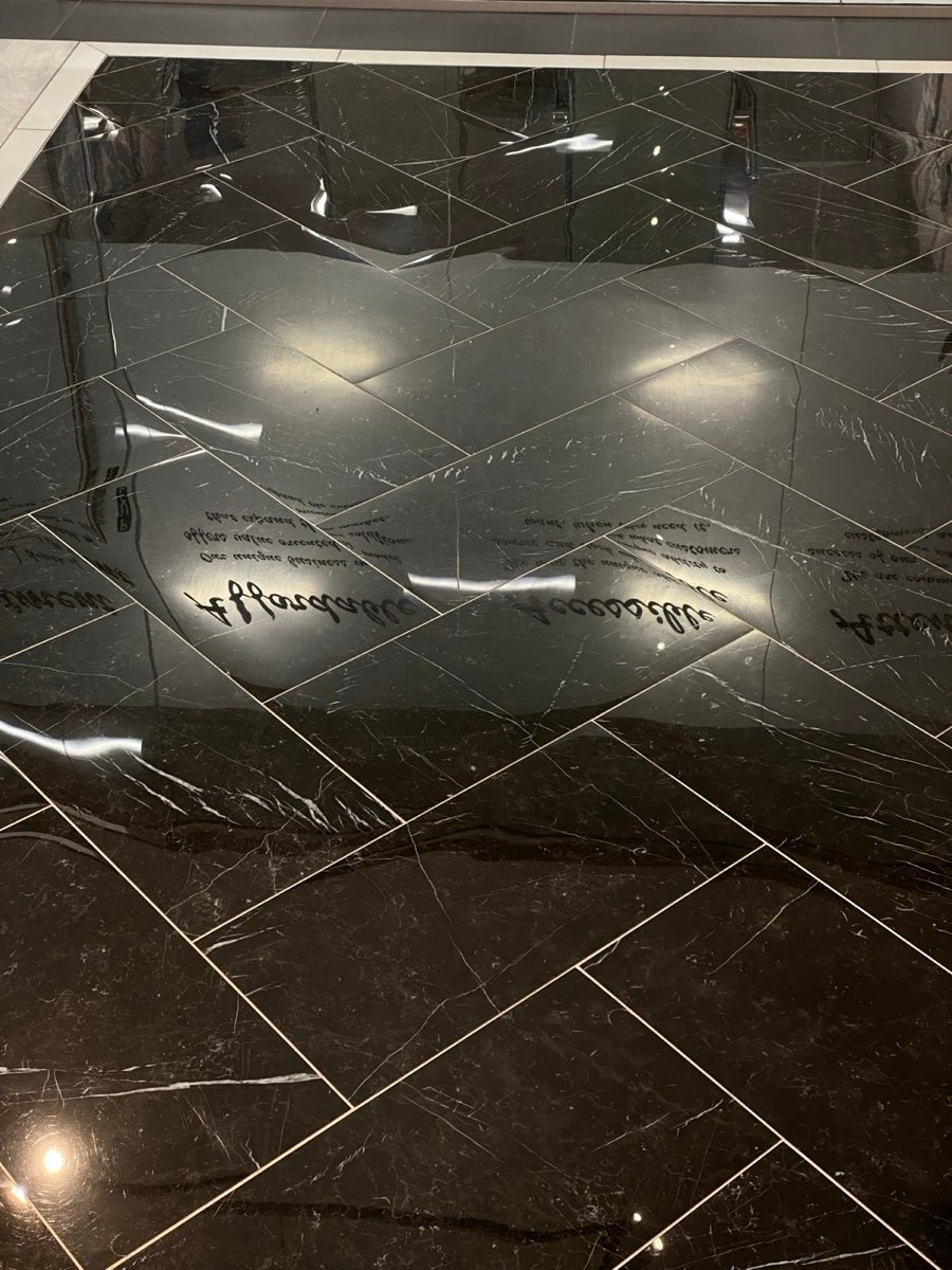 Black herringbone marble-look tile