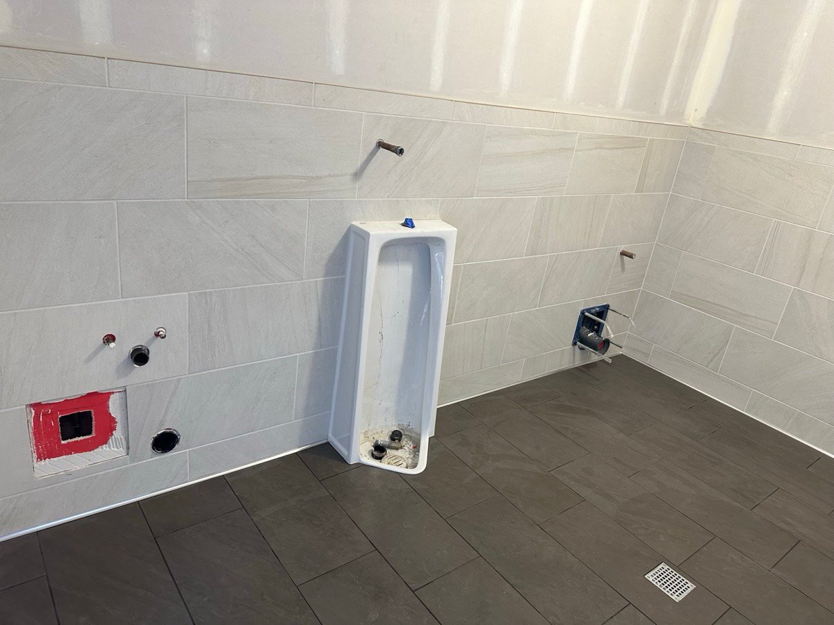 Tile installation across both wall and floor